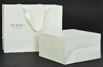 ถุงกระดาษสีขาว มีกระดาษรองก้นถุงขนาด 11.50 x 19.50 ซม.ใช้กระดาษหลังแป้งสีเทา หนา 400 แกรม